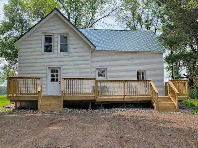 166 95th St, Black Brook Twp, WI 54007 - back of property featuring a metal roof and a deck