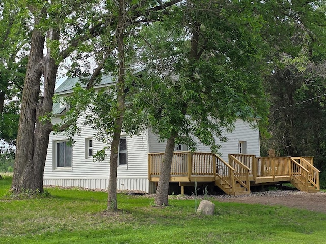 166 95th St, Black Brook Twp, WI 54007 - back of house featuring a lawn and a deck