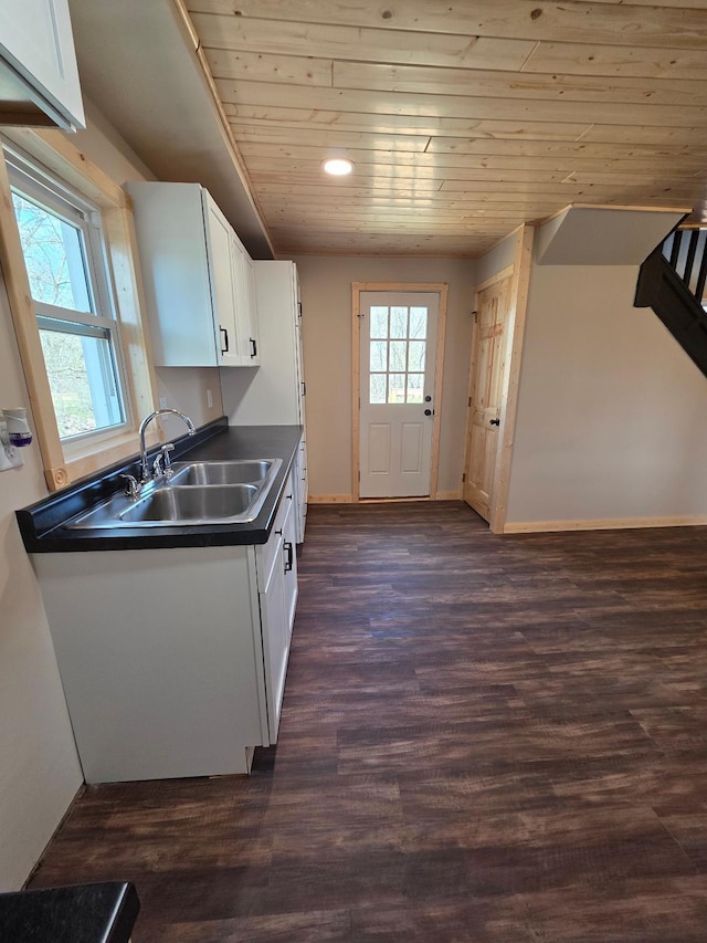 166 95th St, Black Brook Twp, WI 54007 - kitchen with dark countertops, wooden ceiling, white cabinets, dark wood-style floors, and recessed lighting
