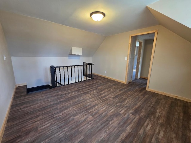 166 95th St, Black Brook Twp, WI 54007 - additional living space featuring dark wood-style flooring and vaulted ceiling