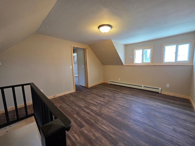 166 95th St, Black Brook Twp, WI 54007 - bonus room featuring a baseboard heating unit, lofted ceiling, and wood finished floors