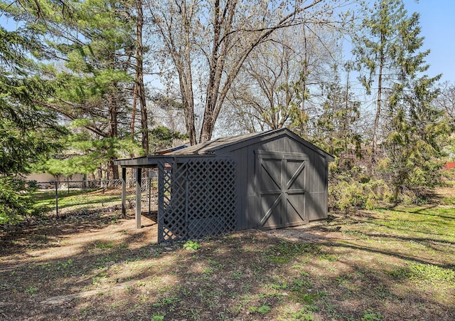 view of shed with fence