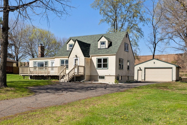 2979 Centerville Rd, Little Canada, MN 55117 - view of front facade with a detached garage, an outdoor structure, a wooden deck, and a front yard