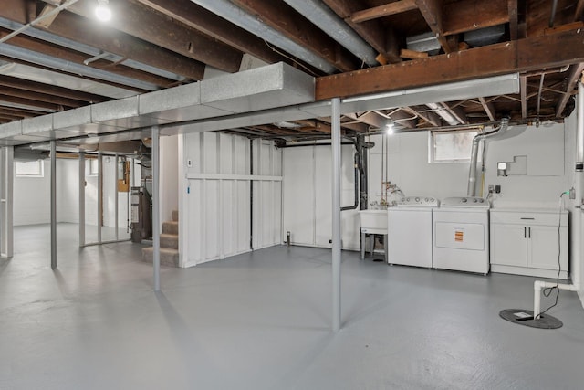 2979 Centerville Rd, Little Canada, MN 55117 - below grade area featuring washing machine and dryer, a sink, and stairway