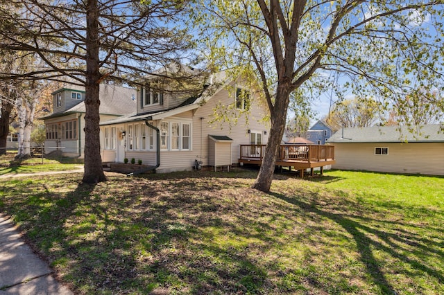 view of yard featuring a deck and fence