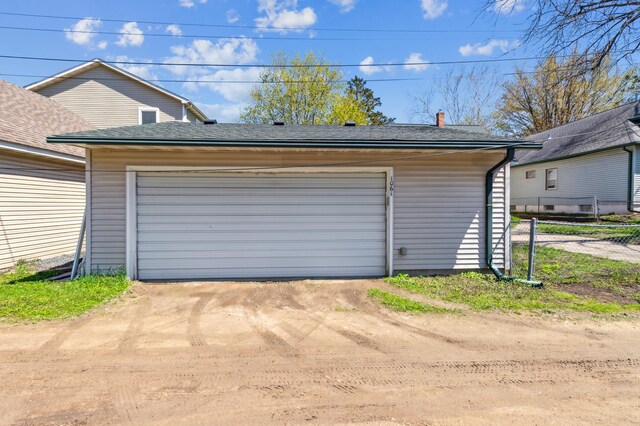 detached garage with fence