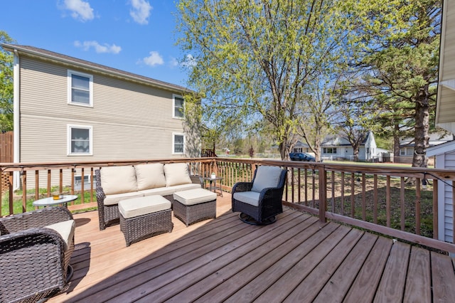 wooden deck with an outdoor living space