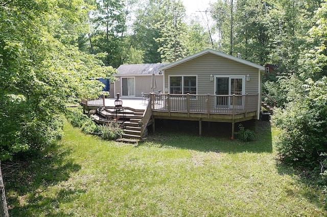 A6 Pathfinder Vlg, Hinckley, MN 55037 - back of property featuring a yard and a wooden deck