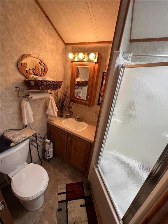 A6 Pathfinder Vlg, Hinckley, MN 55037 - full bathroom with lofted ceiling, vanity, an enclosed shower, toilet, and tile patterned floors
