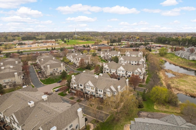view of property location featuring nearby suburban area and a nearby body of water
