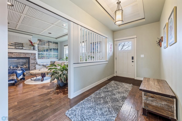 6028 Silverleaf Dr S, Fargo, ND 58104 - foyer with baseboards, wood finished floors, and a fireplace