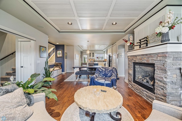 6028 Silverleaf Dr S, Fargo, ND 58104 - living area featuring baseboards, a fireplace, stairs, and wood finished floors