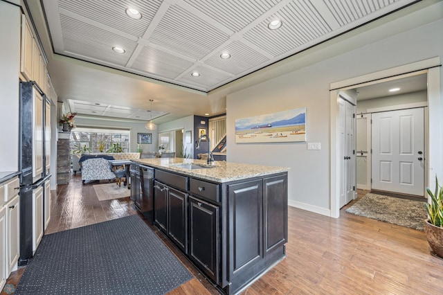 6028 Silverleaf Dr S, Fargo, ND 58104 - kitchen featuring a sink, recessed lighting, light wood-type flooring, a center island with sink, and dishwashing machine