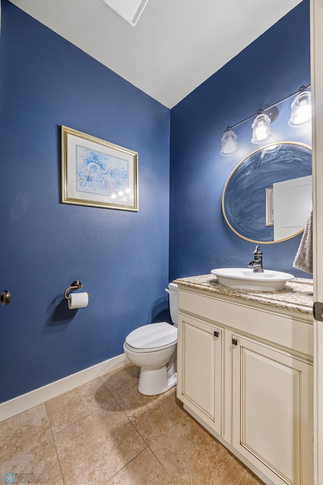 6028 Silverleaf Dr S, Fargo, ND 58104 - bathroom with toilet, baseboards, tile patterned floors, and vanity