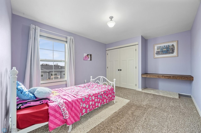 6028 Silverleaf Dr S, Fargo, ND 58104 - bedroom featuring baseboards, carpet, and a closet