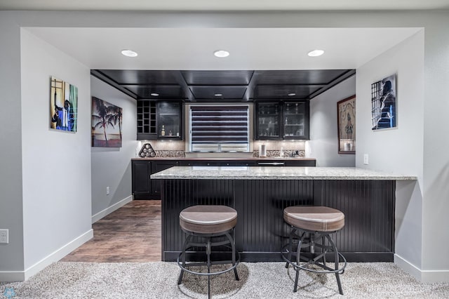 6028 Silverleaf Dr S, Fargo, ND 58104 - bar with backsplash, recessed lighting, baseboards, and bar area