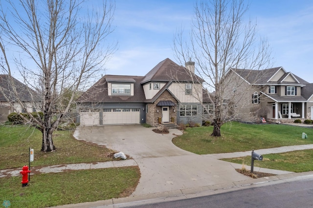 6028 Silverleaf Dr S, Fargo, ND 58104 - view of front of property featuring a garage, a chimney, driveway, and a front lawn
