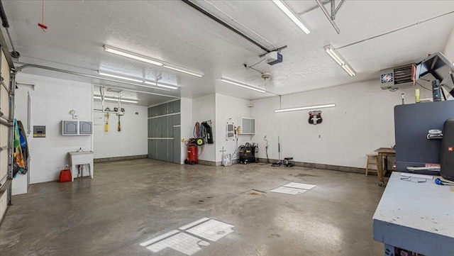 21151 150th St, Sauk Centre, MN 56378 - garage with a garage door opener and baseboards