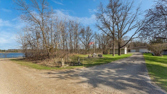 21151 150th St, Sauk Centre, MN 56378 - view of asphalt driveway featuring a water view