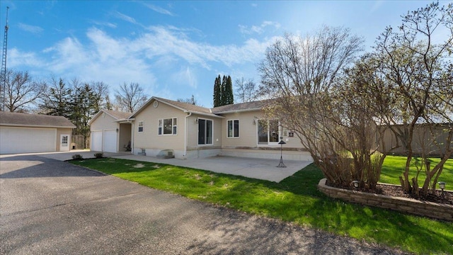21151 150th St, Sauk Centre, MN 56378 - back of property with a lawn and a detached garage