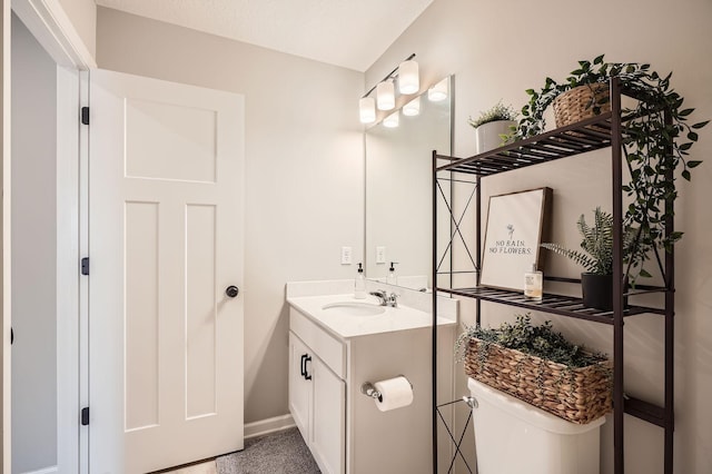 13665 Marsh View Trl, Rogers, MN 55374 - bathroom featuring toilet, baseboards, and vanity
