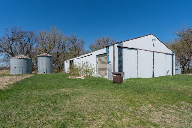 view of pole building with a yard