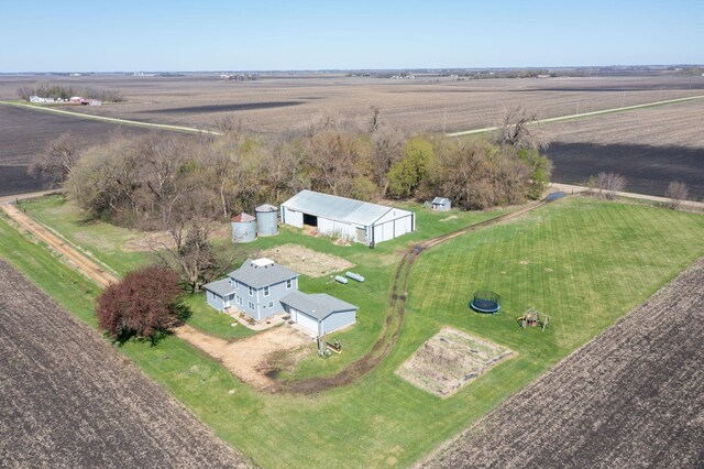 birds eye view of property with a rural view
