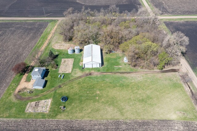 birds eye view of property with a rural view