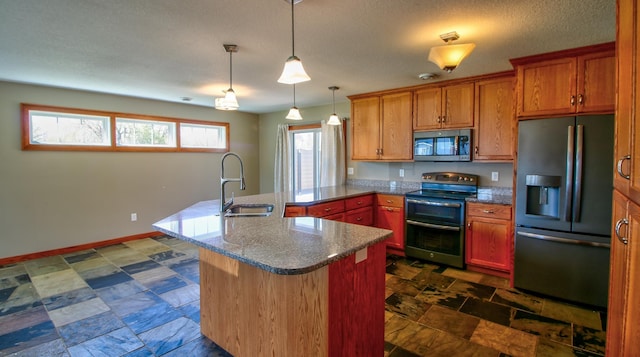 1431 Beech St, Saint Paul, MN 55106 - kitchen featuring appliances with stainless steel finishes, a sink, a peninsula, decorative light fixtures, and brown cabinets