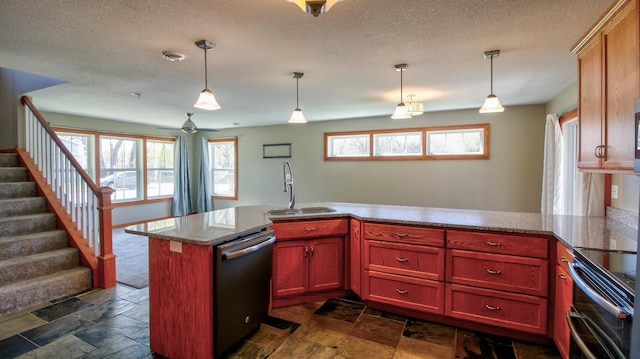 1431 Beech St, Saint Paul, MN 55106 - kitchen featuring stainless steel dishwasher, range with two ovens, a sink, stone tile floors, and a textured ceiling