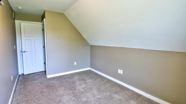 1431 Beech St, Saint Paul, MN 55106 - additional living space with carpet, vaulted ceiling, and baseboards