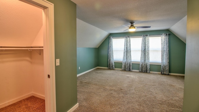1431 Beech St, Saint Paul, MN 55106 - additional living space with lofted ceiling, carpet flooring, ceiling fan, baseboards, and a textured ceiling