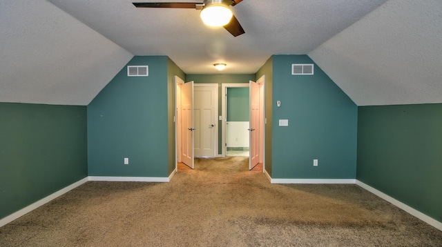 1431 Beech St, Saint Paul, MN 55106 - additional living space featuring ceiling fan, lofted ceiling, carpet floors, a textured ceiling, and baseboards