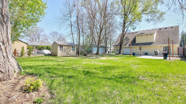 1431 Beech St, Saint Paul, MN 55106 - view of yard featuring a patio and an attached garage