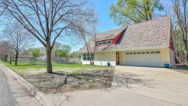 1431 Beech St, Saint Paul, MN 55106 - view of front of house with driveway, an attached garage, and roof with shingles