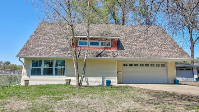 1431 Beech St, Saint Paul, MN 55106 - view of front of home featuring concrete driveway, a garage, and a shingled roof