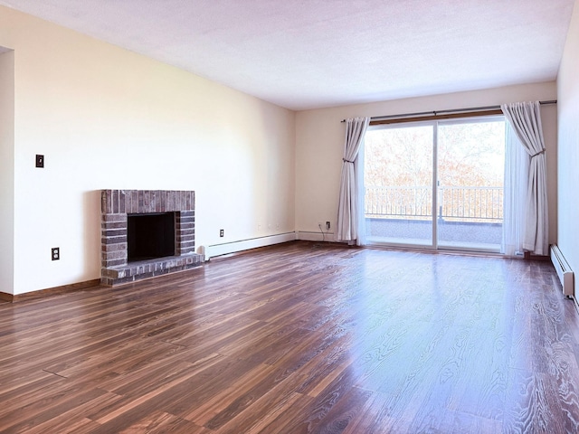 unfurnished living room with dark wood-type flooring, a baseboard radiator, and baseboards