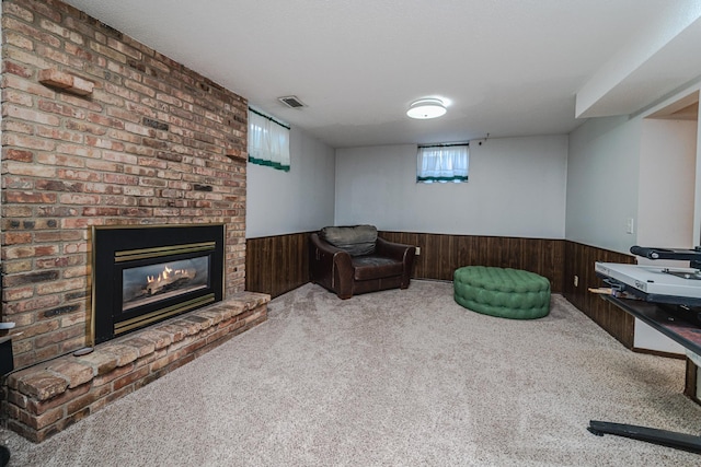 13241 Humboldt Ave S, Burnsville, MN 55337 - living area featuring a wainscoted wall, carpet, wood walls, and a fireplace