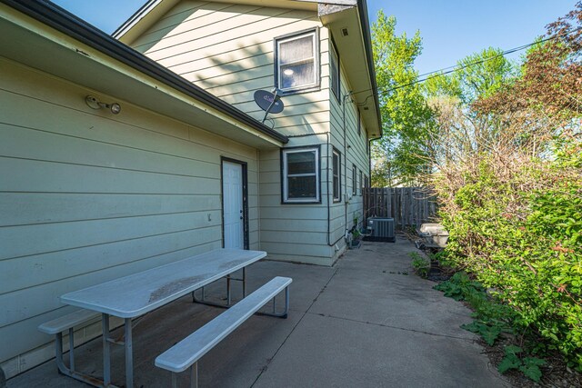 13241 Humboldt Ave S, Burnsville, MN 55337 - view of side of property with central AC unit, fence, and a patio area