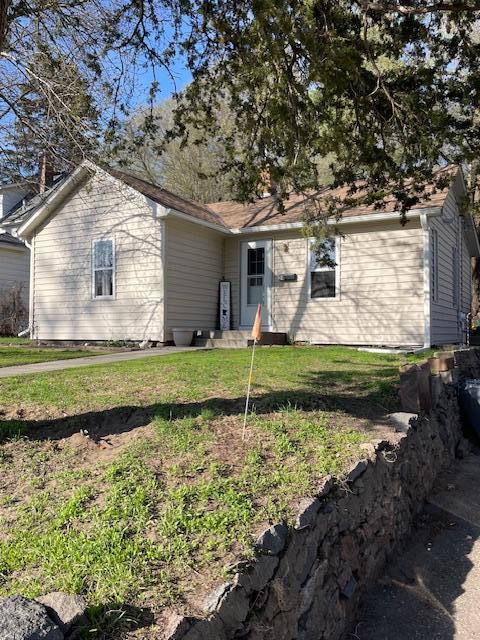 24 3rd Ave S, Sauk Rapids, MN 56379 - rear view of property featuring a lawn