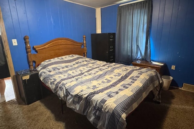 24 3rd Ave S, Sauk Rapids, MN 56379 - carpeted bedroom with wooden walls