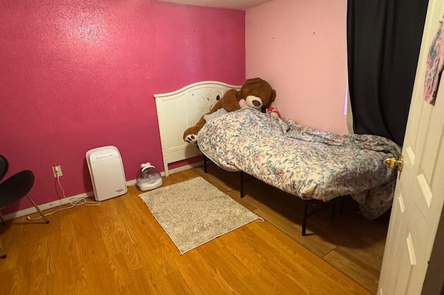 24 3rd Ave S, Sauk Rapids, MN 56379 - bedroom with wood finished floors and baseboards