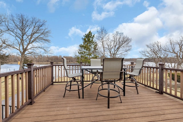 10283 Ferry Point Pl NW, Rice, MN 56367 - wooden deck with outdoor dining area and a water view