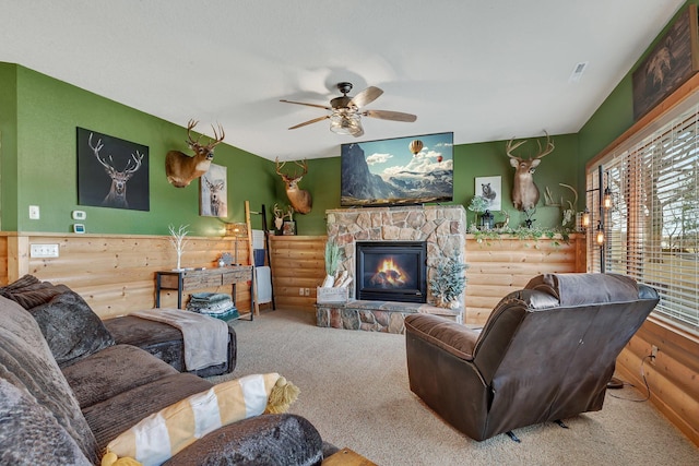 10283 Ferry Point Pl NW, Rice, MN 56367 - carpeted living room featuring a stone fireplace and a ceiling fan