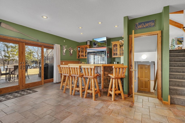 10283 Ferry Point Pl NW, Rice, MN 56367 - bar with indoor wet bar, recessed lighting, stairway, and french doors