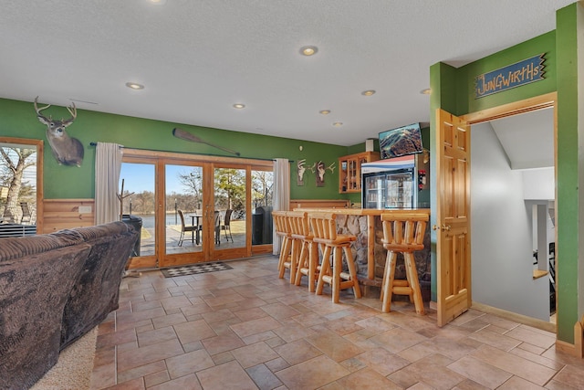 10283 Ferry Point Pl NW, Rice, MN 56367 - bar with a bar, recessed lighting, a healthy amount of sunlight, and french doors