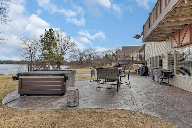 10283 Ferry Point Pl NW, Rice, MN 56367 - view of patio with a deck with water view, stairs, a hot tub, and outdoor dining space