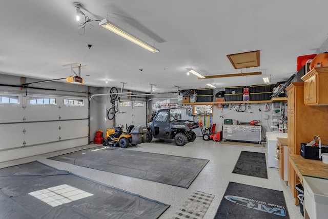 10283 Ferry Point Pl NW, Rice, MN 56367 - garage featuring a garage door opener