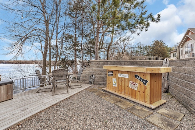 10283 Ferry Point Pl NW, Rice, MN 56367 - view of yard featuring fence and a deck with water view
