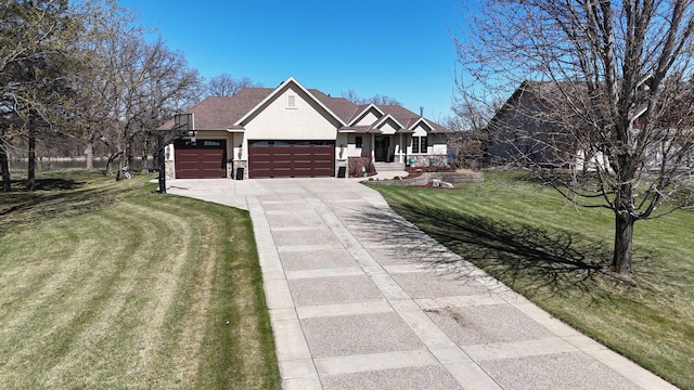 10283 Ferry Point Pl NW, Rice, MN 56367 - view of front of home featuring a garage, stucco siding, driveway, and a front yard